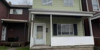 Great 2 bed 2 bath with bonus attic space house located steps from shopping. Gallery 1