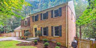 5 BR 4.5 BA home with inground heated pool and extensive hardscape! Gallery 1