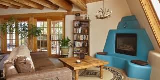 Panacea de Taos | Architect-Designed Earthship Retreat with Hot Tub, Mountain Views & Attached Garage Gallery 1