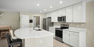 Beautiful Open Layout 4 Bed, 3 Full Bath | A True Masterpiece Backing to a Peaceful Pond with Modern Upgrades + Tesla Charging Gallery 9