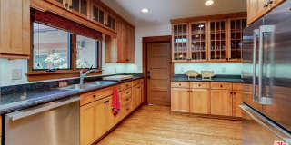 Impeccably restored Craftsman Securely Gated and Hedged for Privacy! Gallery 4