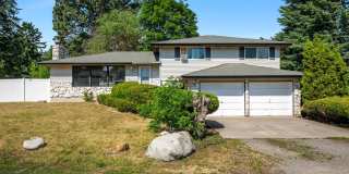 Spacious 3BR + Bonus Tri-Level in Spokane Valley - Fireplace, Corner Lot & Garage Gallery 1