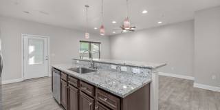 Welcome home to this beautifully maintained townhome in Mossy Oak Village. Gallery 12