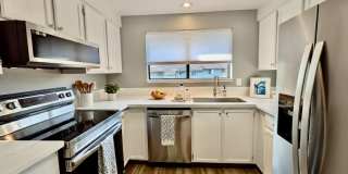 Stunning 2 Bedroom Condo with Fireplace, Modern Upgrades and Air Conditioning! Dogs Welcome Gallery 1