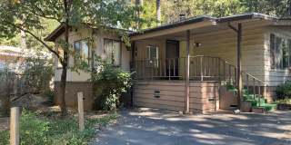 Magalia 2 bed 2 bath home + 2 bonus Rooms with detached garage and carport-partially fenced back yard Gallery 1