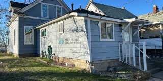 This 3-bed, 1-bath home features original woodwork, a covered front porch, a fenced yard, and an oversized detached garage! Gallery 17
