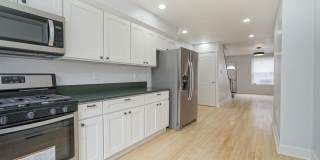 Your New Home In Point Breeze - 3br/1.5ba with wood flooring, granite counter tops, steel appliances and  W Gallery 1