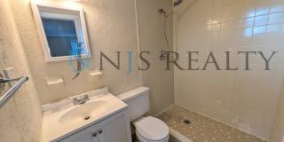True 3 Bed~2 Bath~with garage. Over 1,000 sq ft, with updated kitchen & bathrooms, large open living space & a fenced in yard!! Gallery 11