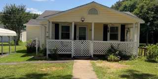 Charming 2-Bedroom Home with an Enclosed Sunroom & Peaceful Outdoor Living Gallery 1