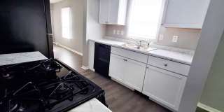 4 Bed / 2 Full Bath House with Brand-New Kitchen, Attached Garage, and Full Basement - Built 2001 Gallery 6