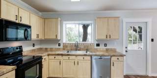 Modern Elegance: 3-Bedroom Townhome with Wood Flooring, Shaded Deck, and Inclusive Amenities Gallery 13