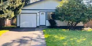 Charming 3BR/1BA w/ 1-car garage, long driveway, fenced yard, wood stove & shed/workshop. Gallery 1