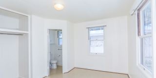 Waiola - upstairs 1 bedroom with 1 parking - window air conditioner in bedroom.. Gallery 13
