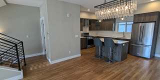 STUNNING 4-LEVEL TOWNHOME IN HIGHLANDS W/ 2-CAR GARAGE +AMAZING ROOFTOP DECK WITH VIEWS! Gallery 6