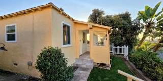 Welcome to your beautiful beach cottage, perfectly situated in Ocean Beach! Gallery 1