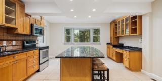 5 BR 4.5 BA home with inground heated pool and extensive hardscape! Gallery 7