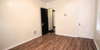 This 2 bedroom 1 bath home has been completely refinished with brilliant hardwood floors throughout! Gallery 11