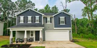 ✨ SPACIOUS 4-BEDROOM HOME WITH FENCED YARD & DOWNSTAIRS SUITE! Gallery 1