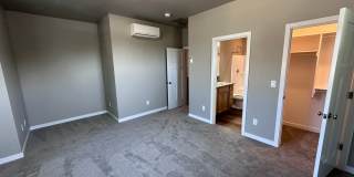 4 Bedroom / 4 bath New Townhome. Every bedroom is its own Master Suite with your own full bathroom, walk in closet and A/C unit. Full-size washer and dryer in your unit. Gallery 19