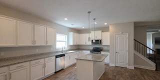 Get ready to fall in love—this sleek, modern beauty in West Creek Farms is bringing the wow factor to Clarksville! Gallery 9