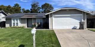 Laminate flooring throughout. Solar panels. Low maintenance yard. Gallery 1