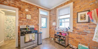 Charming 5-Bedroom Home with Exposed Brick and Modern Upgrades Gallery 9