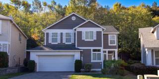 Bright 3-Bedroom Kent Home with Vaulted Ceilings, Covered Patio & 2-Car Garage Bright 3-Bedroom Kent Home with Vaulted Ceilings, Covered Patio & 2-Car Garage Gallery 1