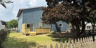 August 15th rent special! New deck! 3 Bedroom, updated kitchen, updated flooring, garage, driveway, and fenced yard - 9 month lease available! Gallery 28