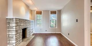 Unique 2BR Downtown Brick Rental – Bonus Space + Backyard Gallery 4