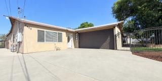 Spacious 4-Bedroom, 2-Bath Gated Home with Garage & Private Backyard Gallery 1