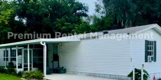 Three bedroom two bath Castleberry manufactured home with a screen porch and carport! Gallery 1