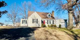 {8520} Charming Four Bedroom in Fantastic Location + Two Main Floor Bedrooms + Hardwood Floors + Fenced Yard + Unfinished basement Gallery 1