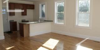 Nicely renovated Townhouse in a prime location near the Green Line with parking included! Gallery 22