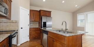 Centrally Located Townhome with Attached Garage & AC Gallery 1