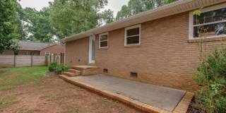 Discover the epitome of stylish living in this meticulously updated mid-century brick ranch, now available for rent. Gallery 23