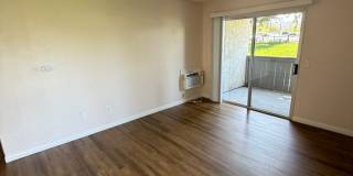 2BR/1BA Lakeside ground floor condo with 1 car detached garage, 1 uncovered parking space & community pool. Gallery 3