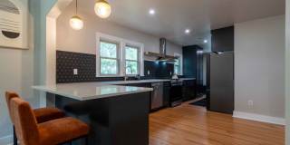 Completely remodeled like new Gingerbread midtown cottage with gleaming hardwoods, converted from a 3/1 to a 3/2. Gallery 15