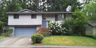 Sweet and spacious home in Beaverton with a garage and large fenced yard available now! Sweet and spacious home in Beaverton with a garage and large fenced yard available now! Gallery 1
