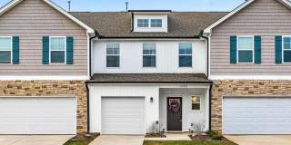 Like new modern maintenance free 3 bedroom 2.5 bath townhouse in Greensboro. Lawn care included. Gallery 1
