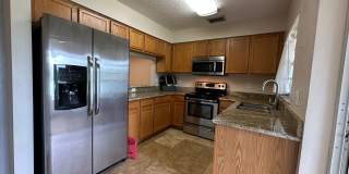 Beautiful Townhome in a gated community with assigned parking spots and a community pool Gallery 9