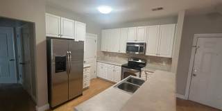 Don't miss this 4-bed, 3-bath condo TWO miles from the ocean! Gallery 3
