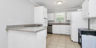 Discover the charm of this brick ranch nestled in the heart of Madison Park Gallery 13