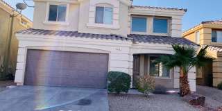 Beautiful & large Rhodes Ranch guard gated community 4 bedroom home with the master bedroom downstairs and a big loft upstairs! With a covered backyard patio. Community features pool, spa, gym, and parks! Gallery 1