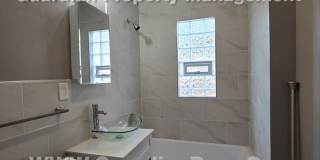 Large main floor duplex unit, Updated Kitchen & Bath, Full Dining Room w/Built-ins + Sunroom, garage stall Gallery 10