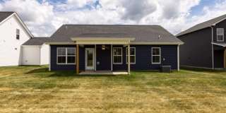 Modern Living Redefined with Stone Fireplace, Gray Cabinetry, Spa Inspired Primary Suite and Covered Outdoor Retreat Gallery 20