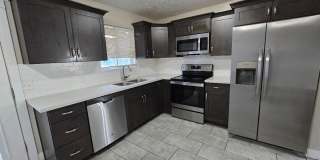 Spacious 5-Bedroom Magna Home with Deck and Ample Parking Gallery 1