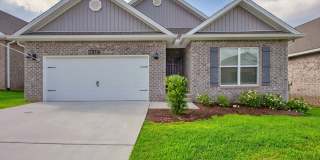 Gated Luxury Living in Beulah – 4BR Home with Screened Porch  Serene Wooded Views | Available July 17th Gallery 1