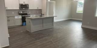 Single family slab home with three car garage. This home is 4 bedrooms, three bathrooms open floor plan. Zero entry home. Mowing included. Gallery 3
