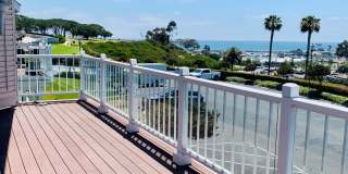 Perched above the stunning Dana Point Harbor, this gorgeous two-story condo offers breathtaking harbor and sunset ocean views from an unbeatable coastal location. Gallery 1