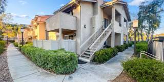 Rancho San Diego- Beautiful Mirasol Complex- 2 bed / 2 bath Upstairs Condo w A/C, Laundry + Parking- Summer Special! $750 OFF YOUR FIRST MONTH - Gallery 1